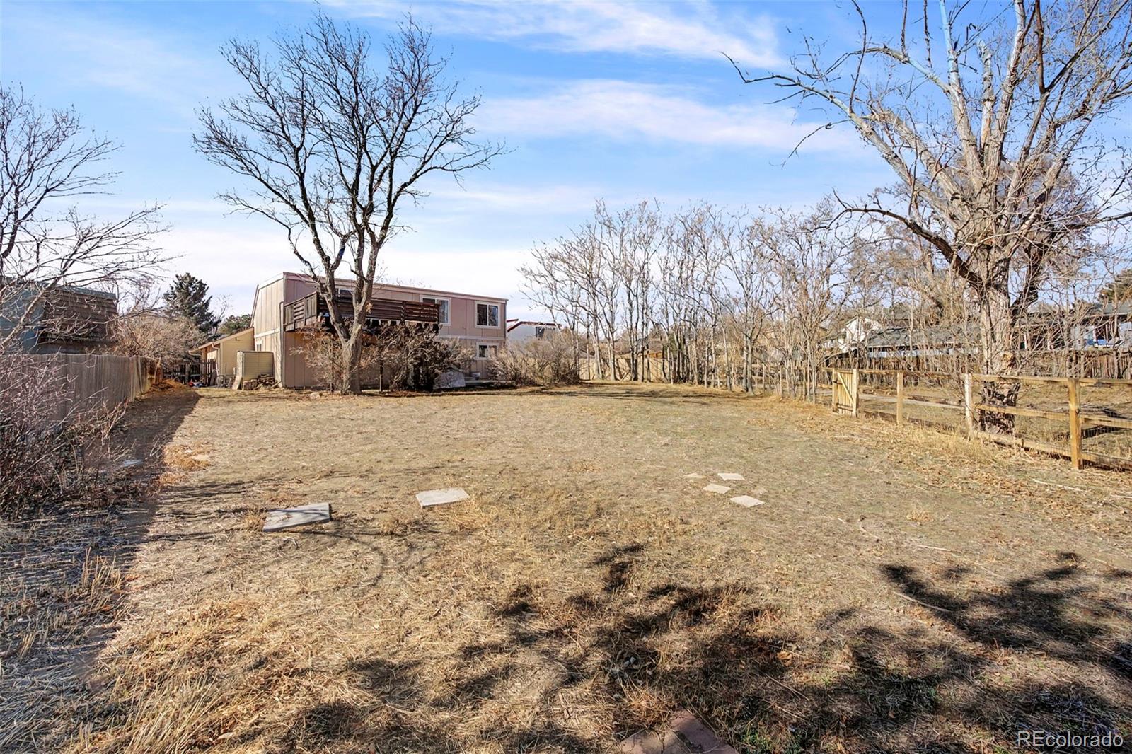 4394 South Van Gordon Way Morrison, CO 80465 - Photo 20 of 20 a view of yard covered with snow in front of house