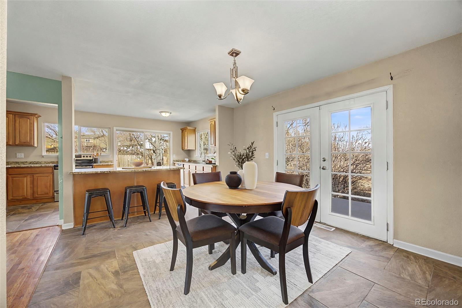 4394 South Van Gordon Way Morrison, CO 80465 - Photo 5 of 20 a view of a dining room with furniture window and outside view