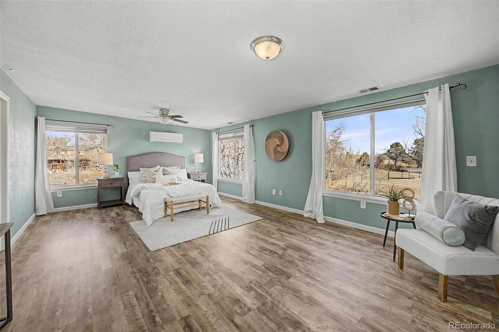 4394 South Van Gordon Way Morrison, CO 80465 - Photo 9 of 20 a bedroom with a bed and a large window