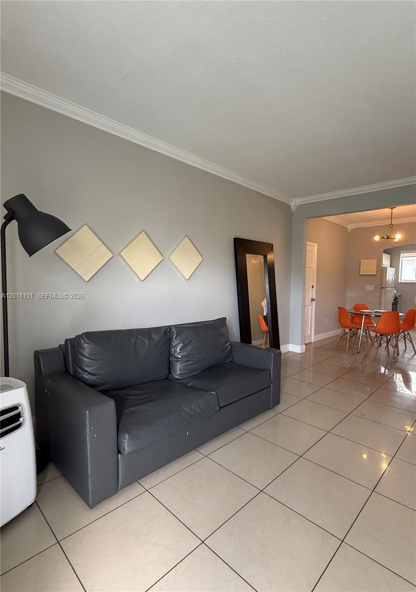 7710 Harding Avenue, Unit 1 Miami Beach, FL 33141 - Photo 7 of 10 a living room with furniture