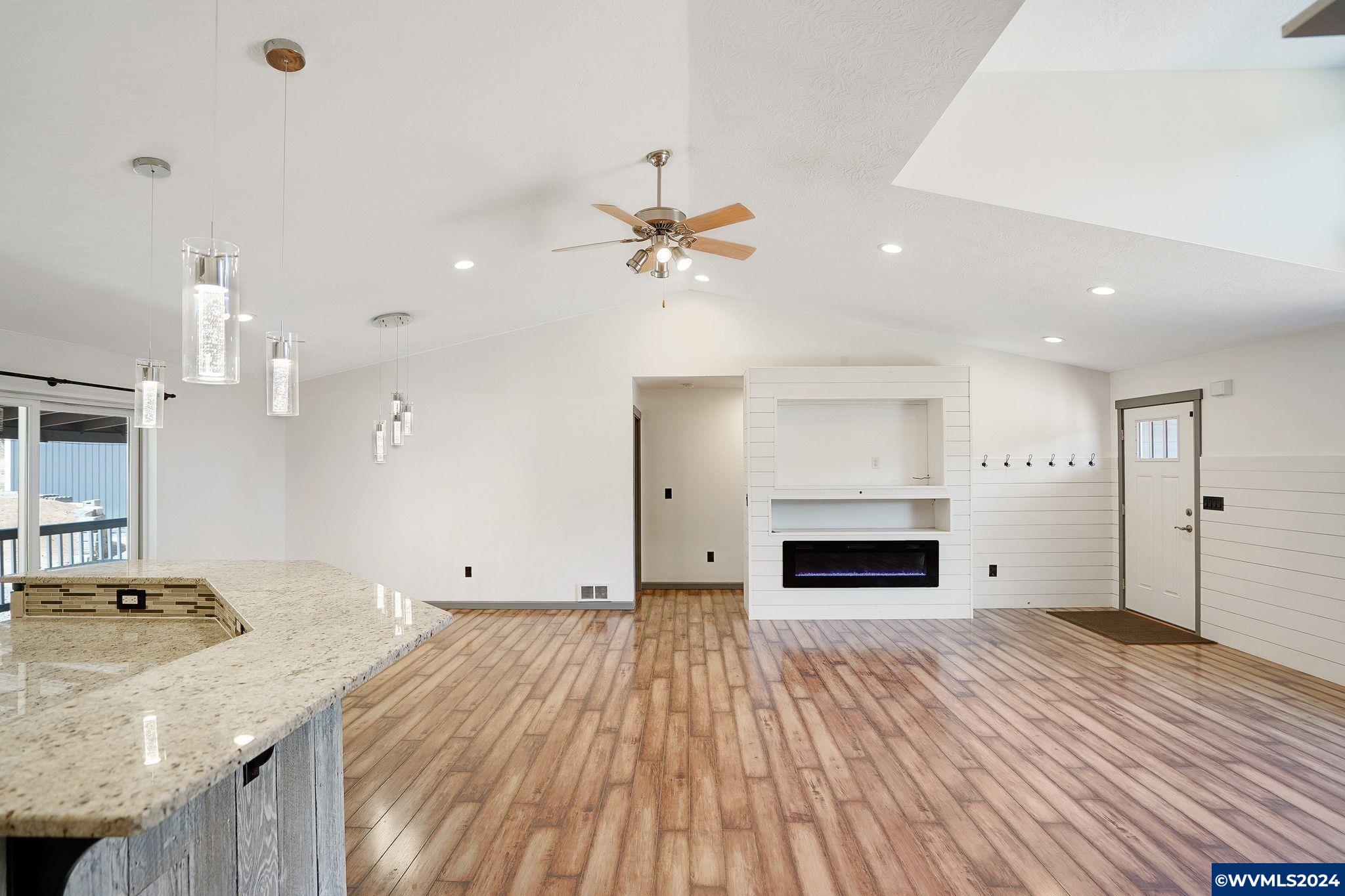 16480 Oakdale Road Dallas, OR 97338 - Photo 17 of 42 a view of a kitchen and a ceiling fan wooden floor