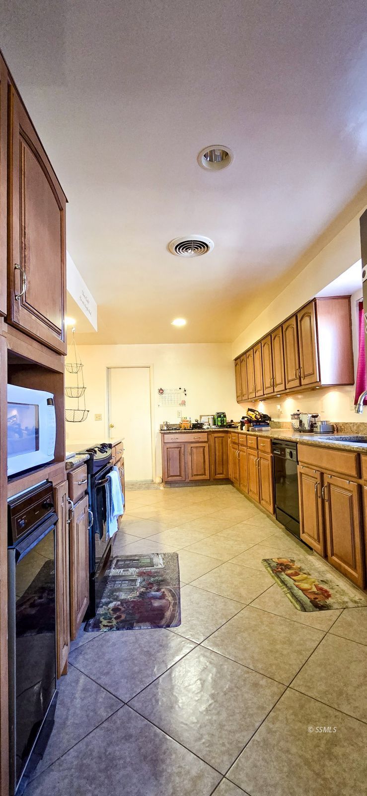 813 West Alene Avenue Ridgecrest, CA 93555 - Photo 3 of 26 a view of a kitchen with a sink and a stove top oven