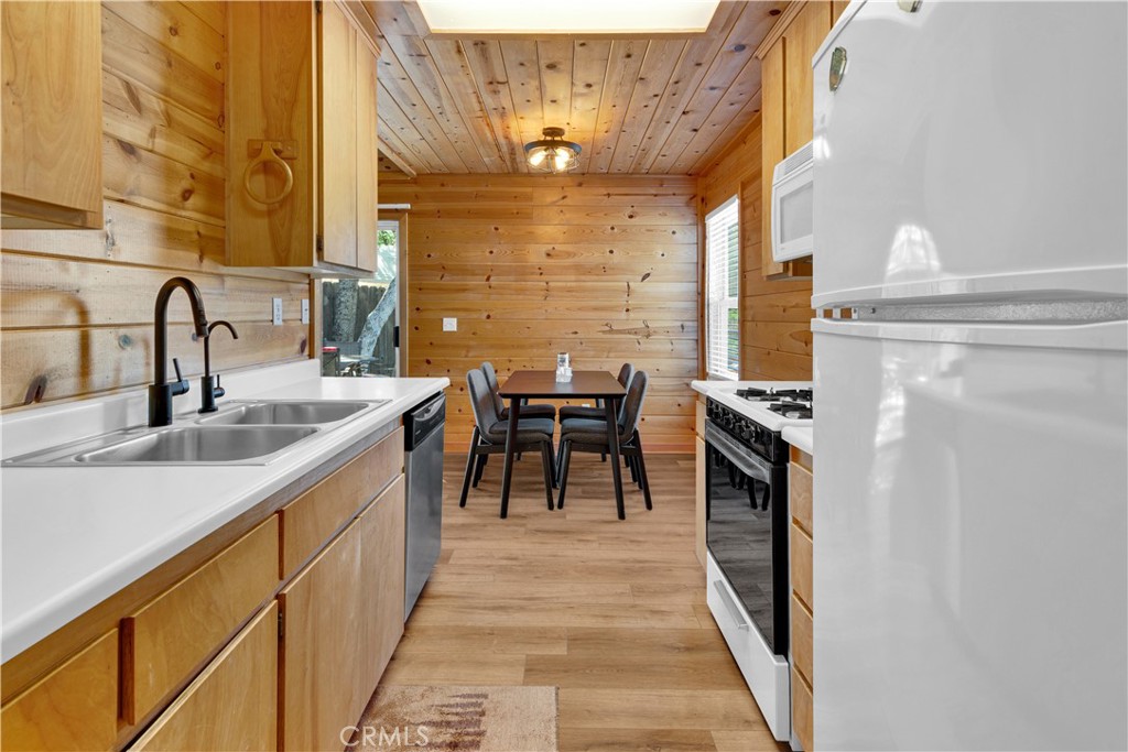 8040 Ready Road Bradley, CA 93426 - Photo 11 of 40 a kitchen with stainless steel appliances a sink and a refrigerator