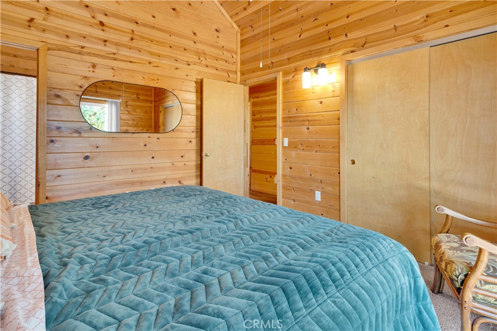 8040 Ready Road Bradley, CA 93426 - Photo 16 of 40 a bedroom with a bed and wooden floor