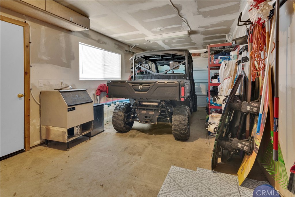 8040 Ready Road Bradley, CA 93426 - Photo 18 of 40 a view of a storage room with furniture fridge and window