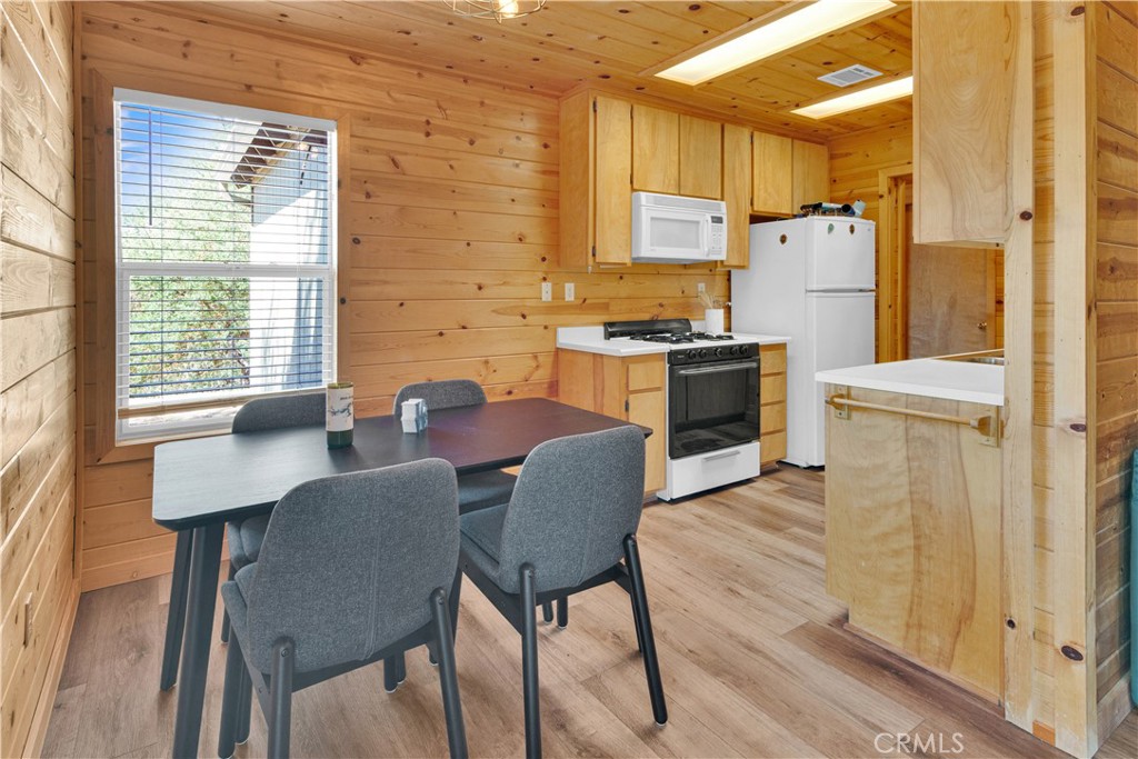 8040 Ready Road Bradley, CA 93426 - Photo 9 of 40 a kitchen with stainless steel appliances granite countertop a stove a refrigerator a table and chairs