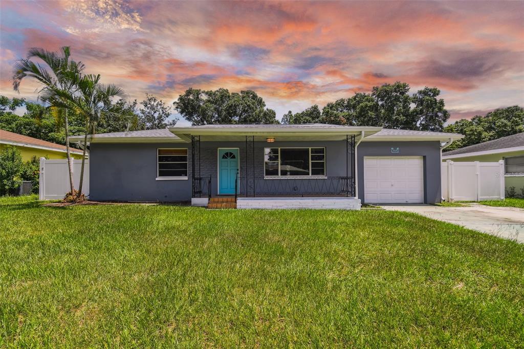 909 Normandy Road Clearwater, FL 33764 - Photo 1 of 1 a front view of house with yard and green space