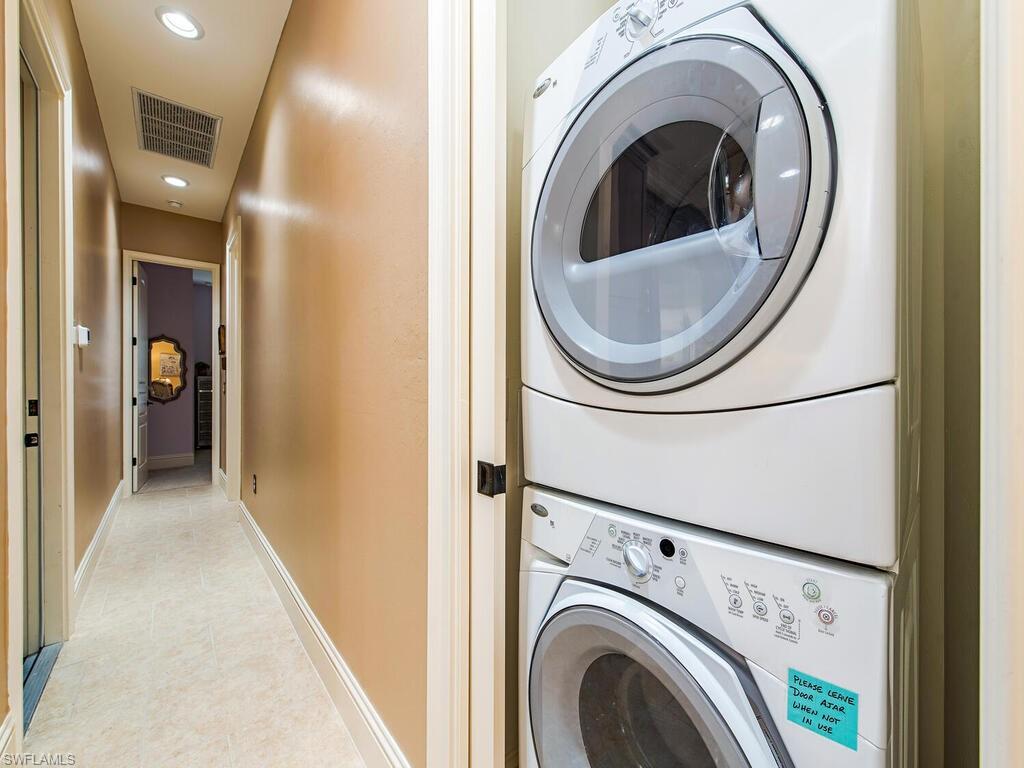 8000 Cordoba Place Naples, FL 34113 - Photo 14 of 16 a utility room with dryer and washer