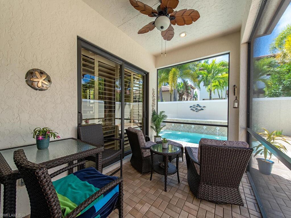 8000 Cordoba Place Naples, FL 34113 - Photo 15 of 16 a living room with furniture and a window