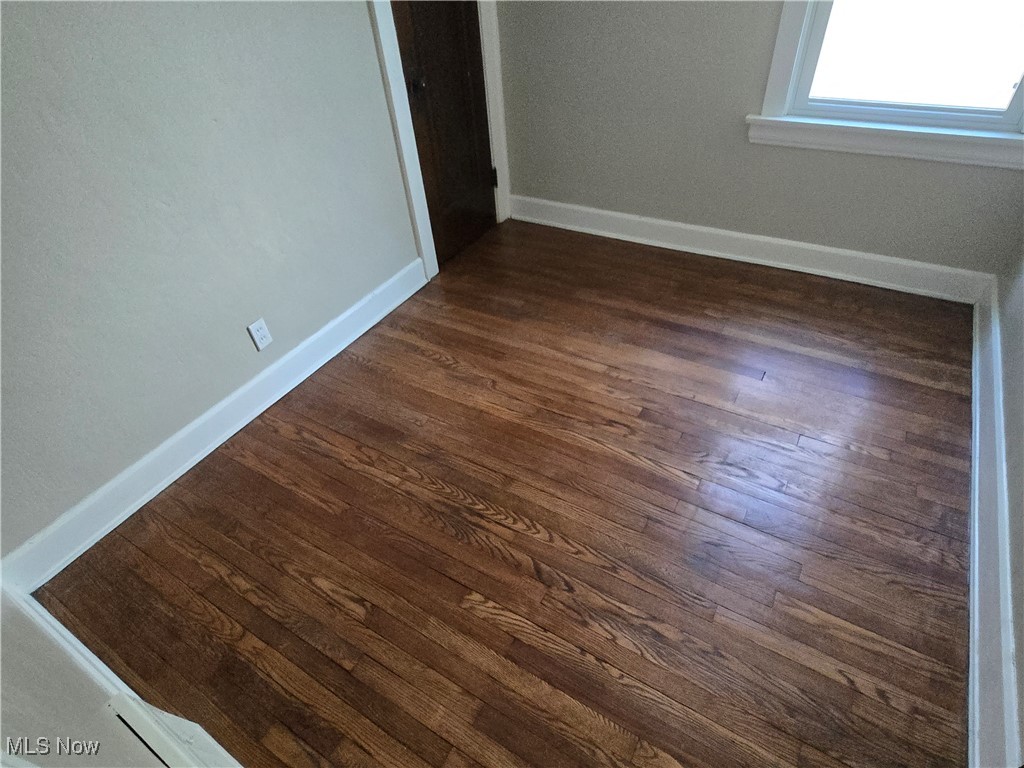 2048 Rossmoor Road Cleveland Heights, OH 44118 - Photo 23 of 29 Empty room featuring dark wood finished floors