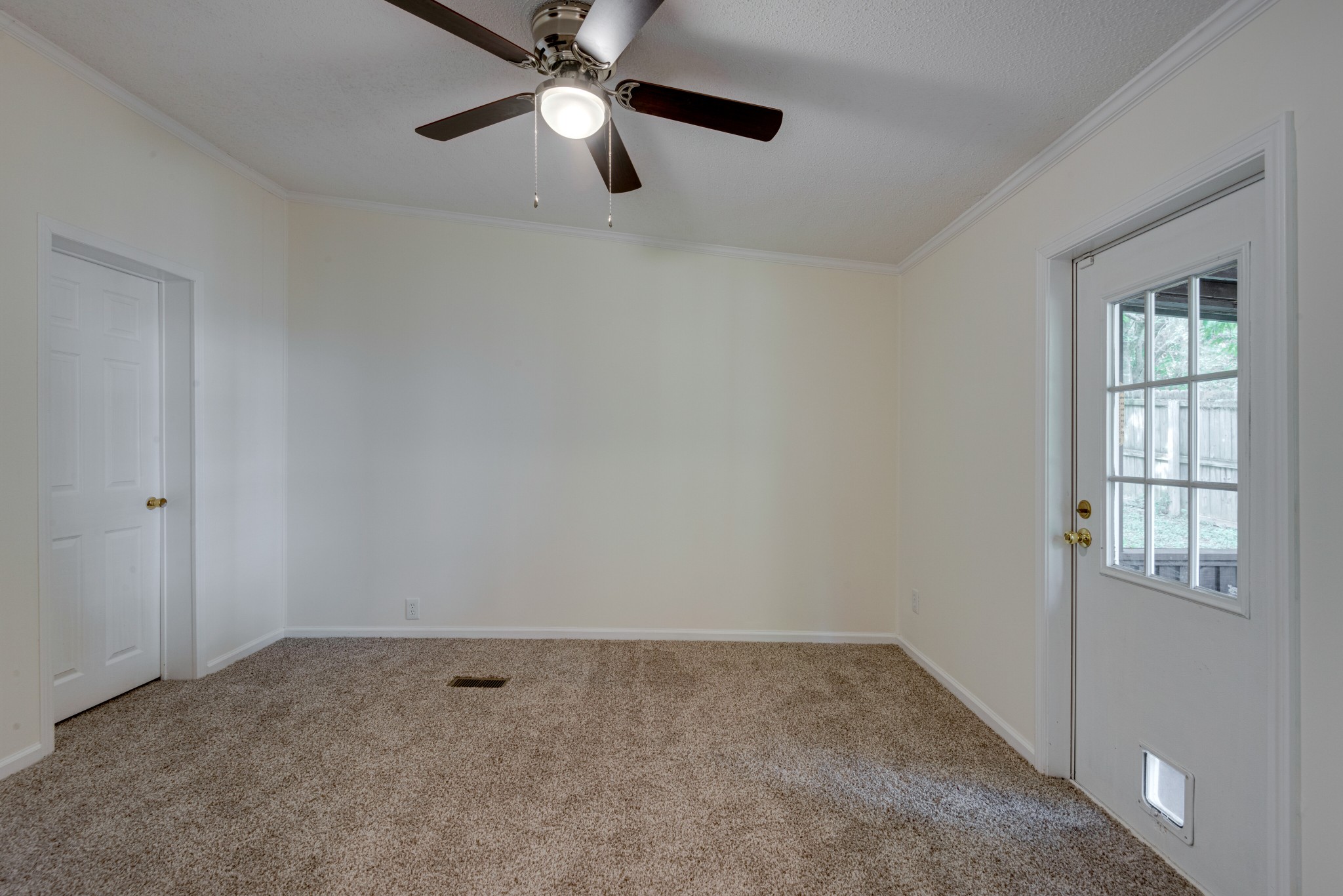 211 Hillcrest Road Kingston Springs, TN 37082 - Photo 14 of 28 an empty room with windows and fan