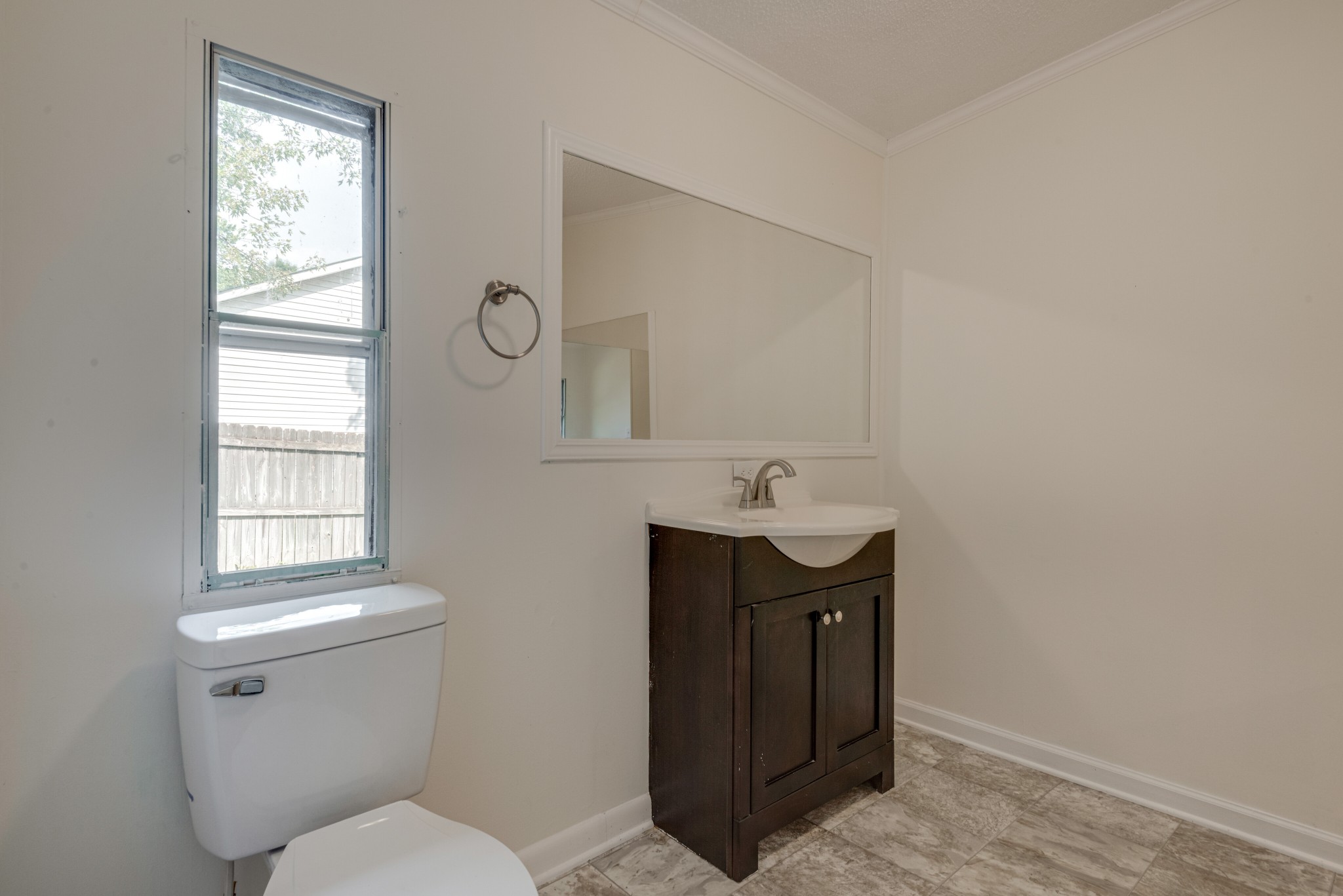 211 Hillcrest Road Kingston Springs, TN 37082 - Photo 16 of 28 a bathroom with a toilet a sink and mirror