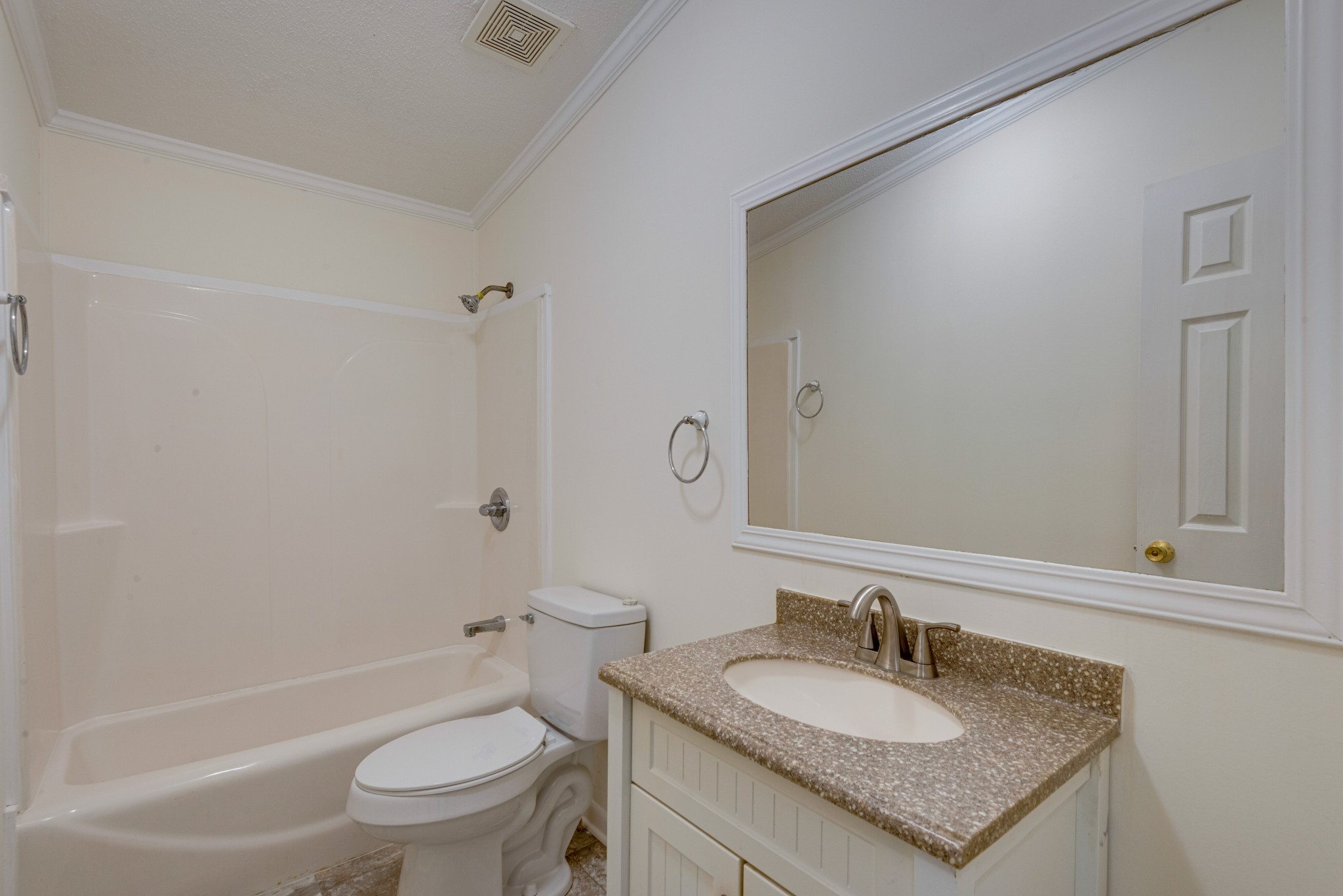 211 Hillcrest Road Kingston Springs, TN 37082 - Photo 21 of 28 a bathroom with a granite countertop toilet a sink and a mirror