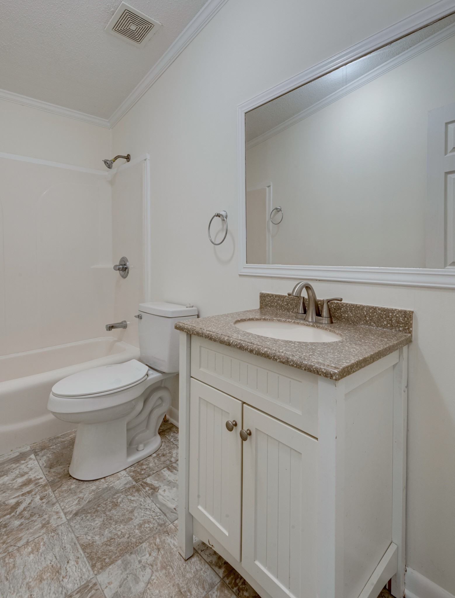 211 Hillcrest Road Kingston Springs, TN 37082 - Photo 22 of 28 a bathroom with a granite countertop toilet a sink and a mirror