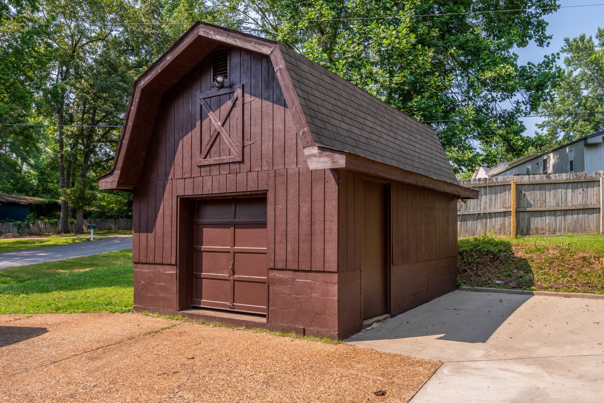 211 Hillcrest Road Kingston Springs, TN 37082 - Photo 28 of 28 a view of a wooden house with a small yard