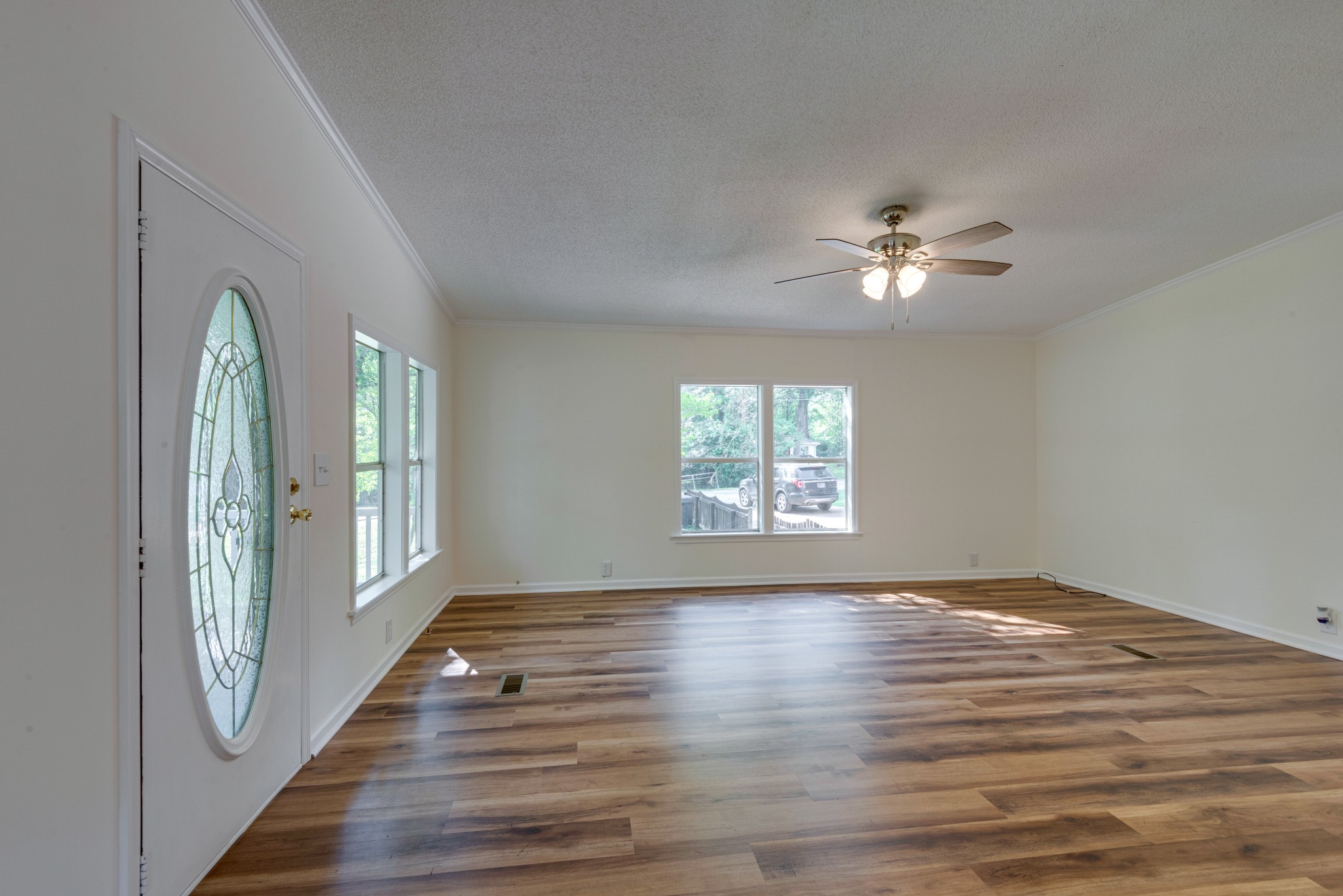 211 Hillcrest Road Kingston Springs, TN 37082 - Photo 6 of 28 wooden floor in an empty room with a window