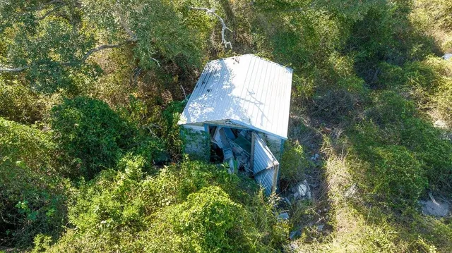 a view of a house with a tree