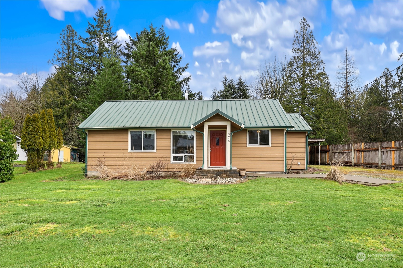 3640 Gull Harbor Road Northeast Olympia, WA 98506 - Photo 1 of 28 a front view of house with yard and trees in the background