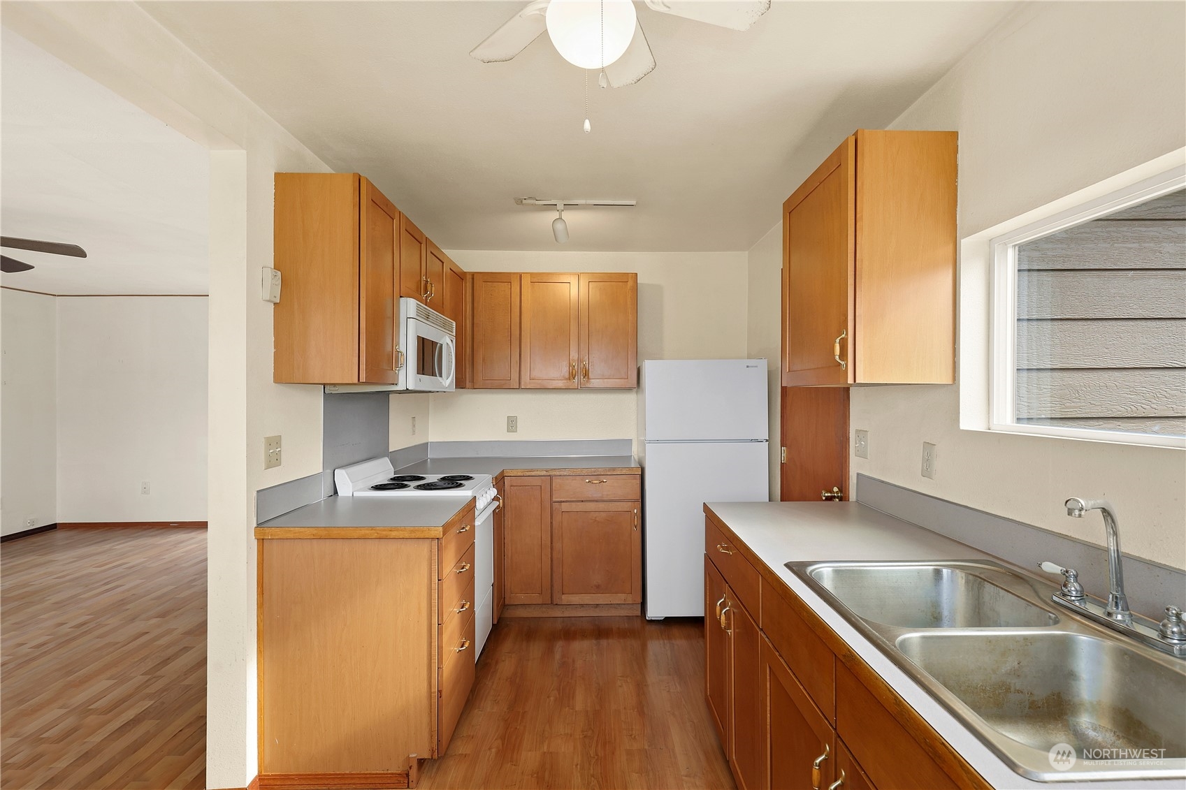 3640 Gull Harbor Road Northeast Olympia, WA 98506 - Photo 11 of 28 a kitchen that has a sink cabinets counter space and appliances