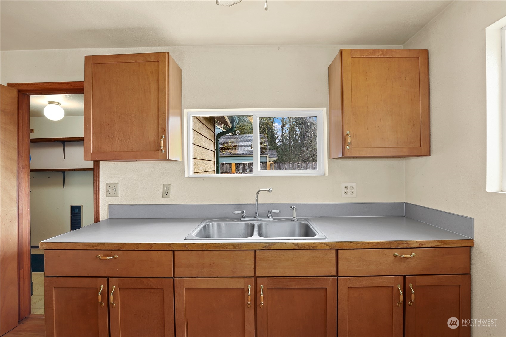 3640 Gull Harbor Road Northeast Olympia, WA 98506 - Photo 13 of 28 a kitchen with a sink and cabinets