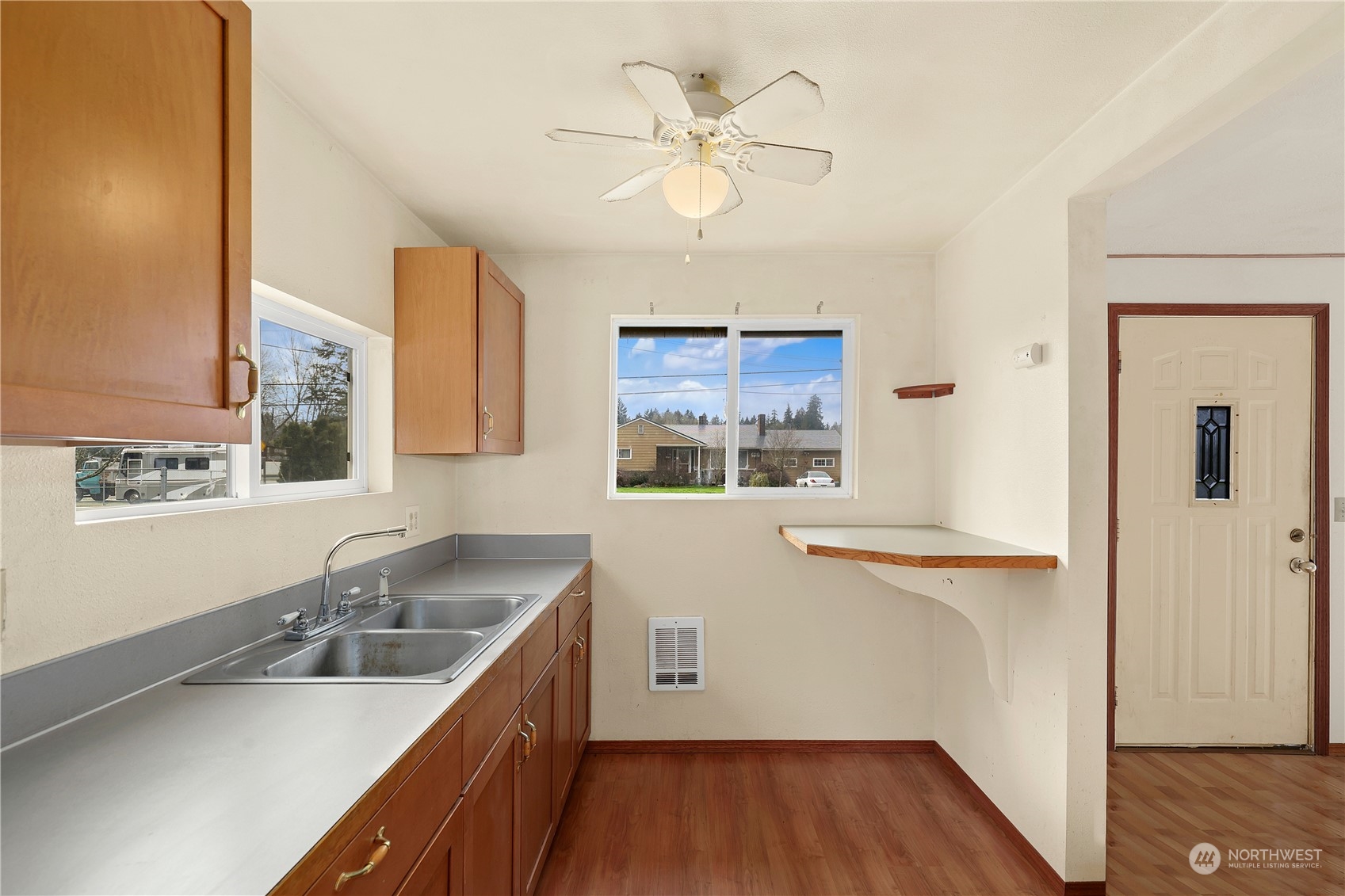 3640 Gull Harbor Road Northeast Olympia, WA 98506 - Photo 14 of 28 a kitchen with a sink cabinets and window