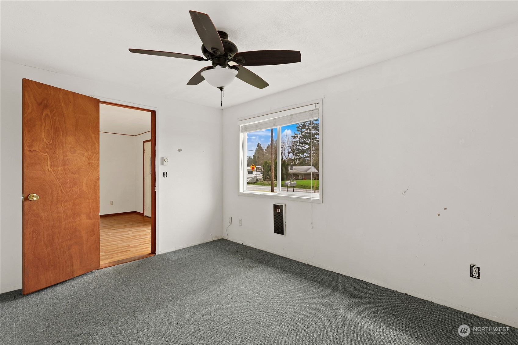 3640 Gull Harbor Road Northeast Olympia, WA 98506 - Photo 20 of 28 a view of a livingroom with a ceiling fan & windows