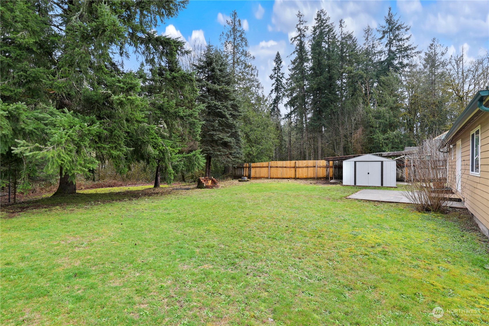 3640 Gull Harbor Road Northeast Olympia, WA 98506 - Photo 26 of 28 a view of a house with backyard and a tree
