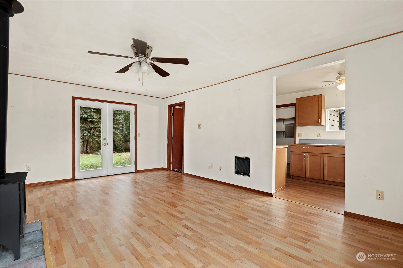 3640 Gull Harbor Road Northeast Olympia, WA 98506 - Photo 6 of 28 a view of empty room with wooden floor and ceiling fan