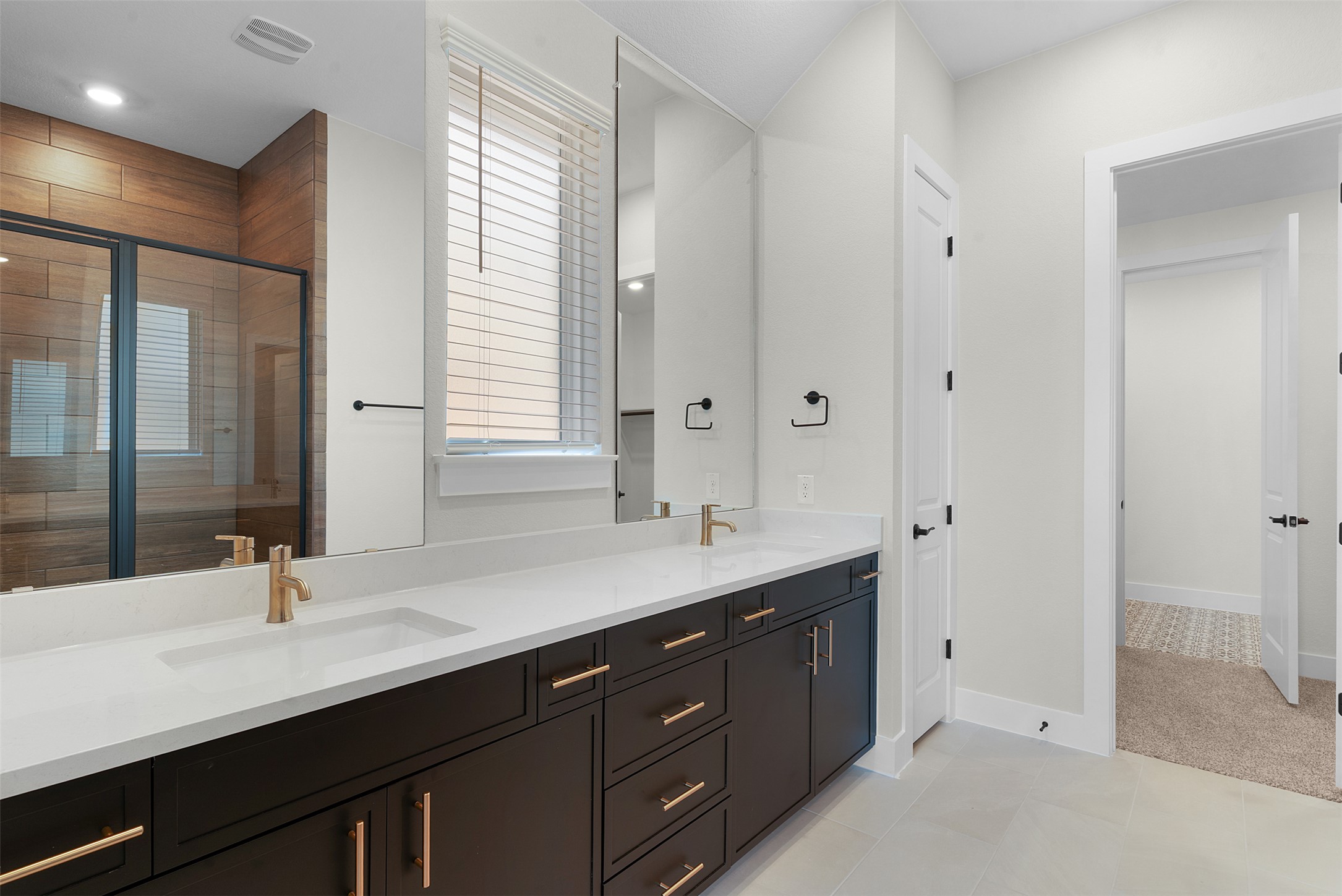 1121 Pansy Trail Georgetown, TX 78628 - Photo 13 of 25 Full bathroom with double vanity, a stall shower, and light tile patterned floors