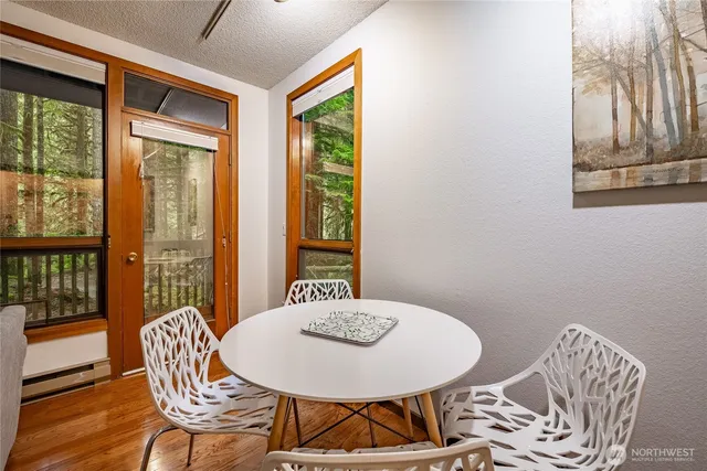 a view of a dining room with furniture window and outside view