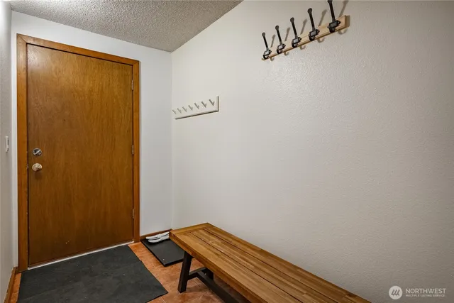 a room with a wooden door and shower