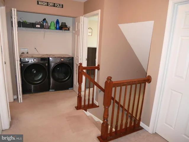 a bedroom with a bed and a mirror