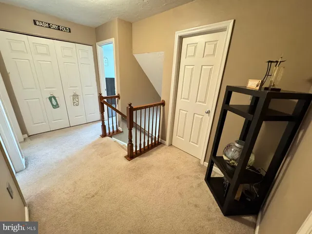 a bathroom with a granite countertop toilet a sink and a bathtub