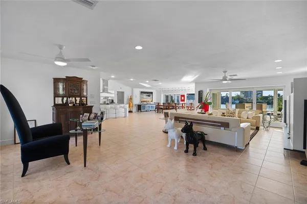 a living room with furniture and a table