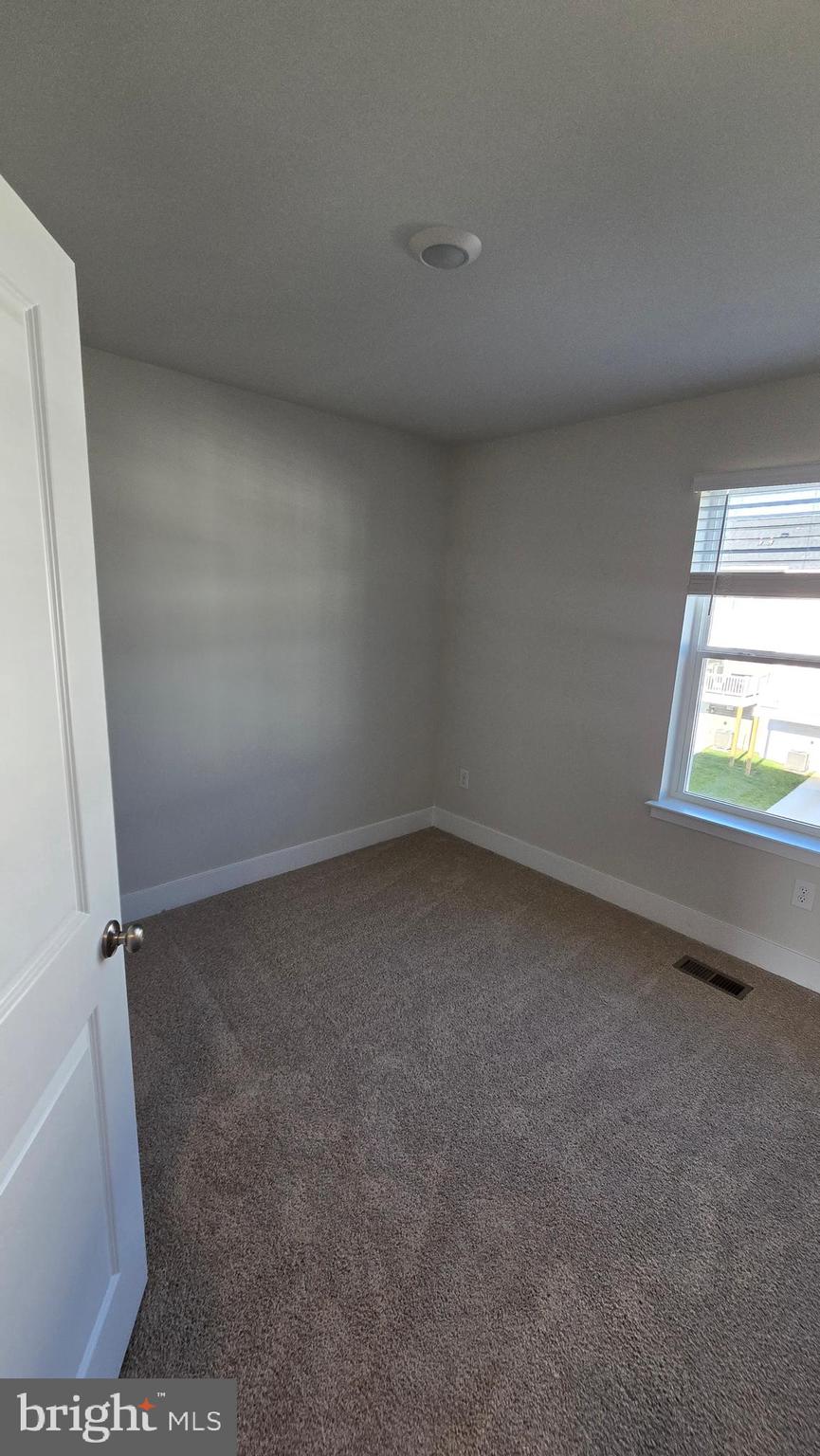 52 Aloma Street Ranson, WV 25438 - Photo 32 of 44 an empty room with a window