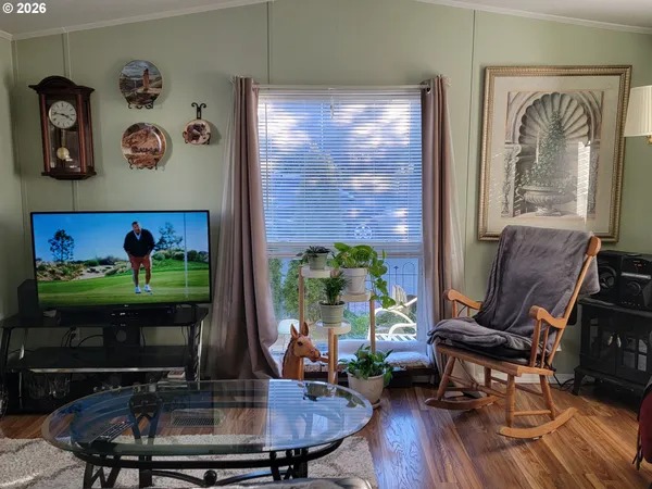 a room with furniture and a floor to ceiling window