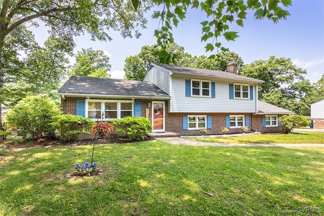 10820 Weybridge Road Chester, VA 23831 - Photo 3 of 46 a front view of a house with a garden