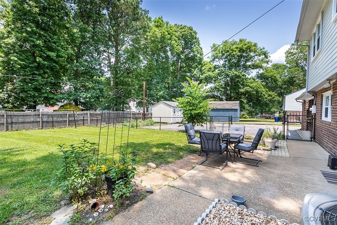 10820 Weybridge Road Chester, VA 23831 - Photo 37 of 46 a view of a house with backyard sitting area and garden