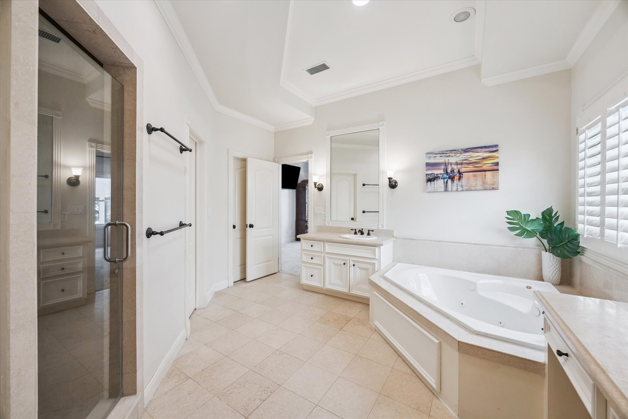 3818 Case Street West University Place, TX 77005 - Photo 18 of 29 a spacious bathroom with a tub sink shower and mirror