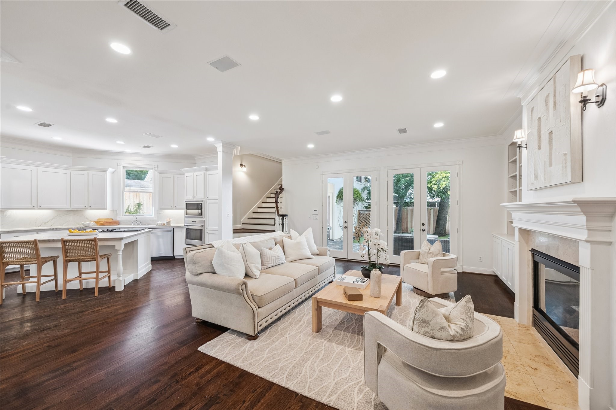 3818 Case Street West University Place, TX 77005 - Photo 7 of 29 a living room with furniture a fireplace and a kitchen view
