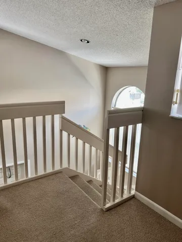 a view of a hallway with staircase