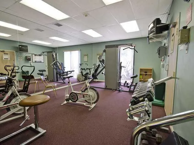 a living room with lots of furniture and a chandelier