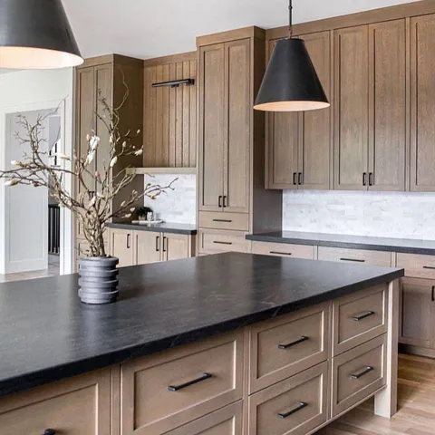 a kitchen with cabinets and window