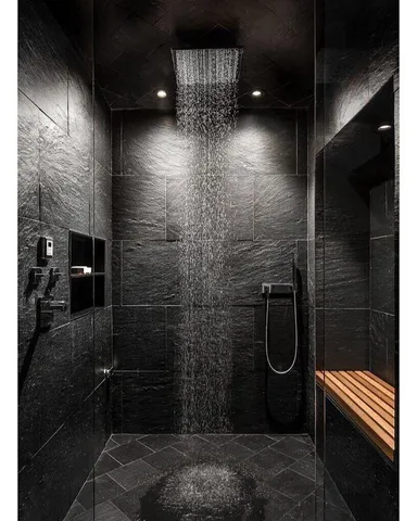 a bathroom with a sink a mirror and a potted plant