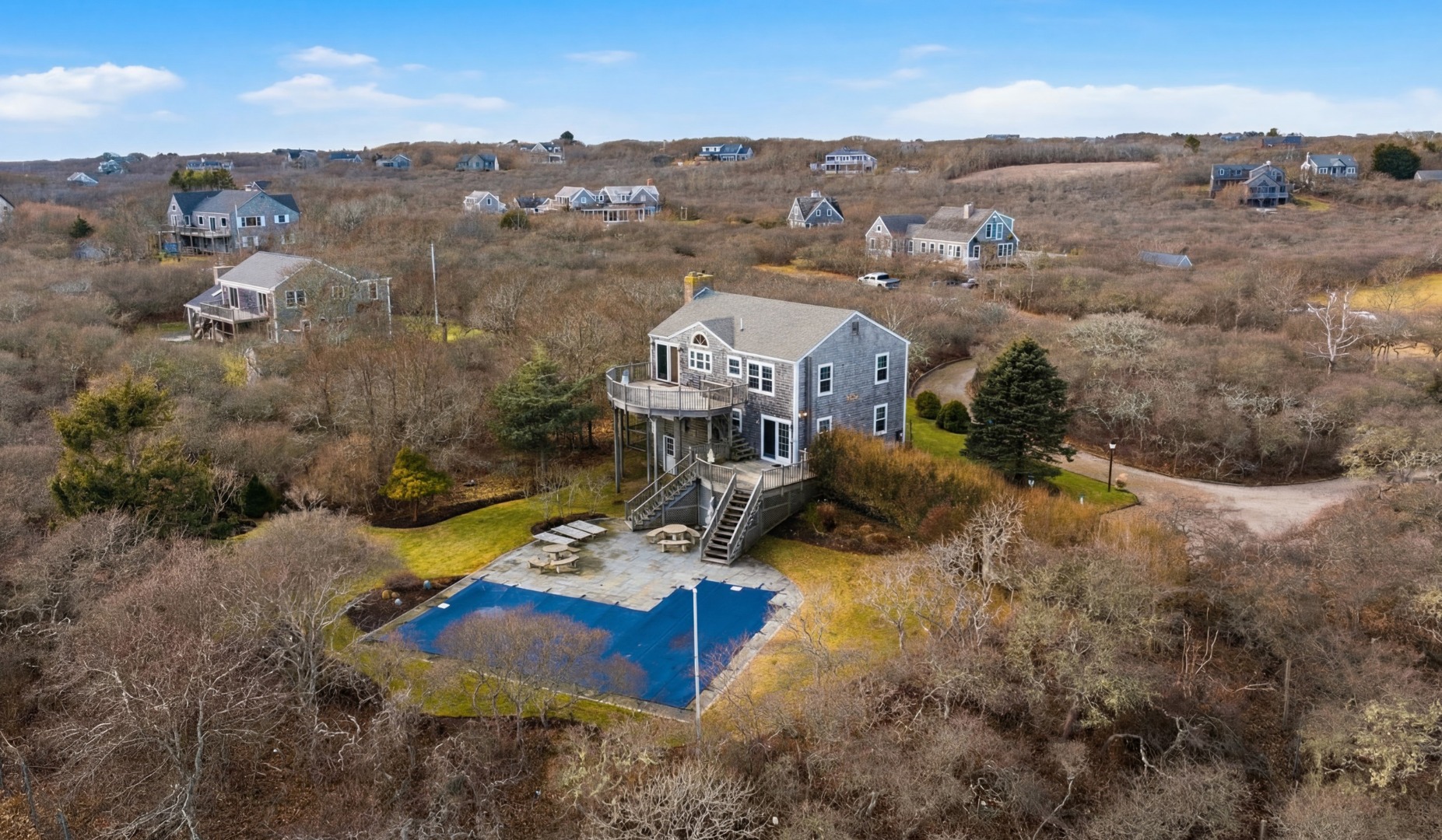 31 Flintlock Road Nantucket, MA 02554 - Photo 23 of 23 a view of a house with a mountain and a yard