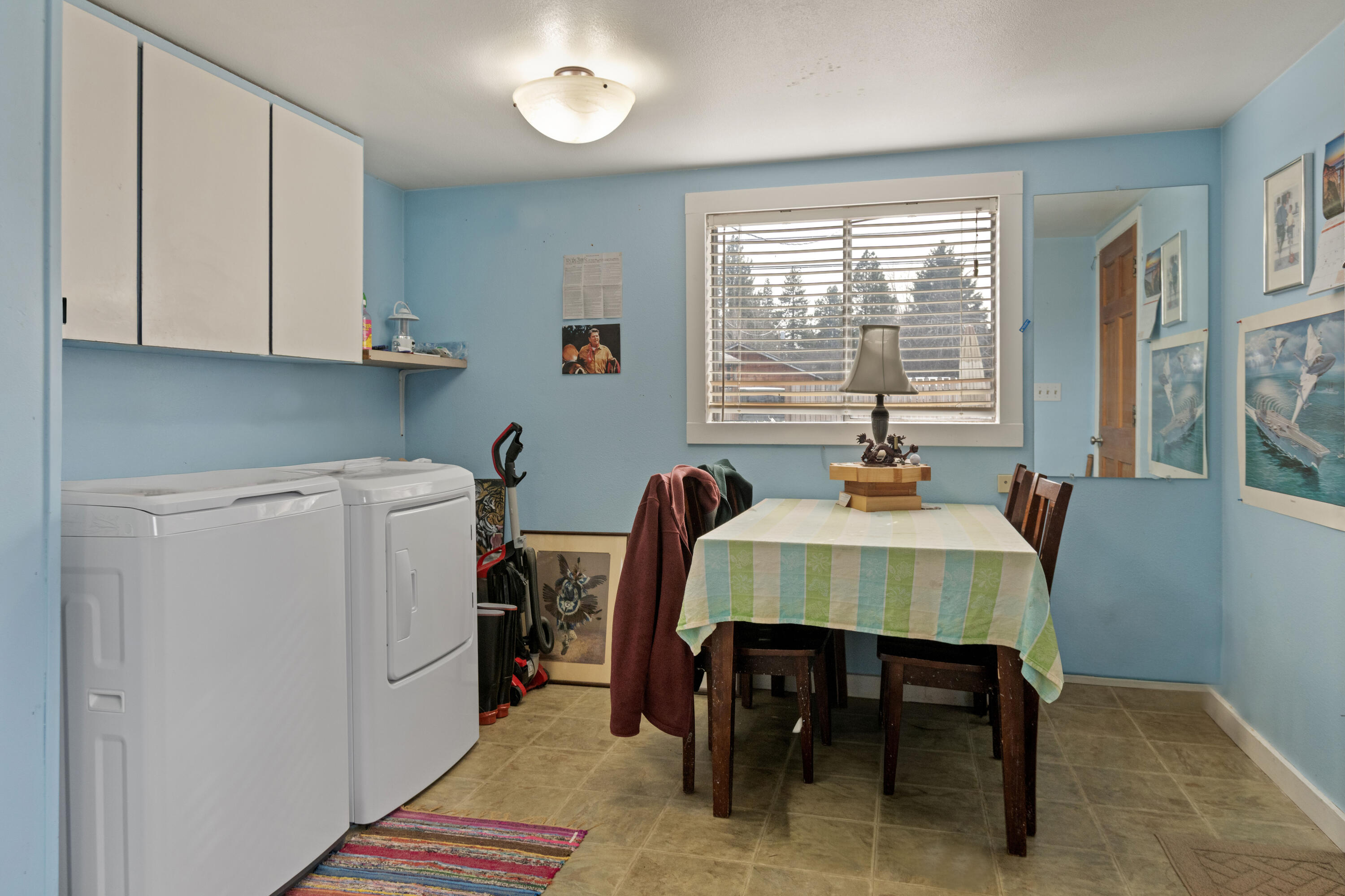 243 West Adams Avenue Sisters, OR 97759 - Photo 6 of 19 a view of a dining room with furniture and window