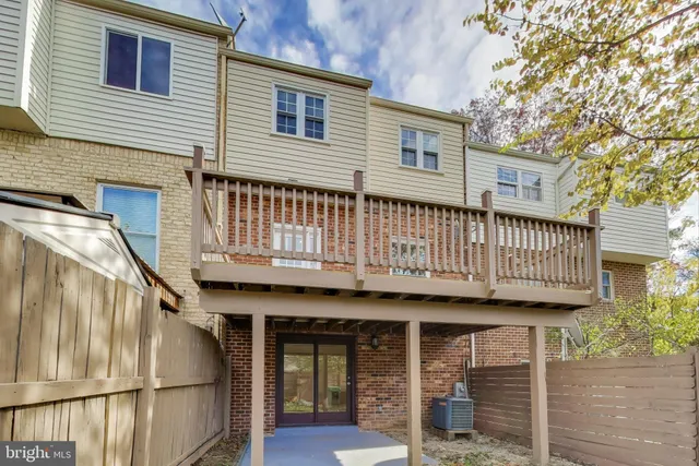 a view of a house with wooden deck