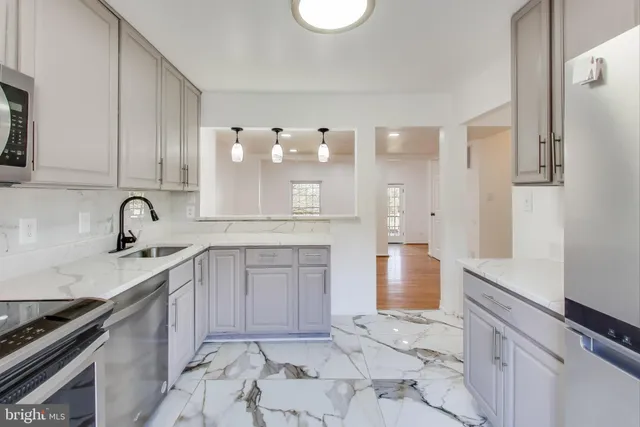 a kitchen with a sink and cabinets