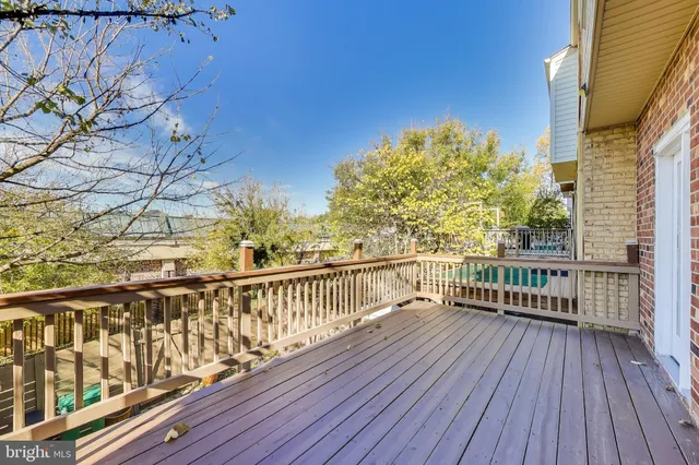 a view of balcony with wooden floor
