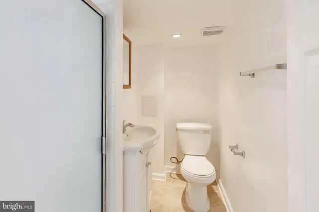 a view of a house with a wooden fence